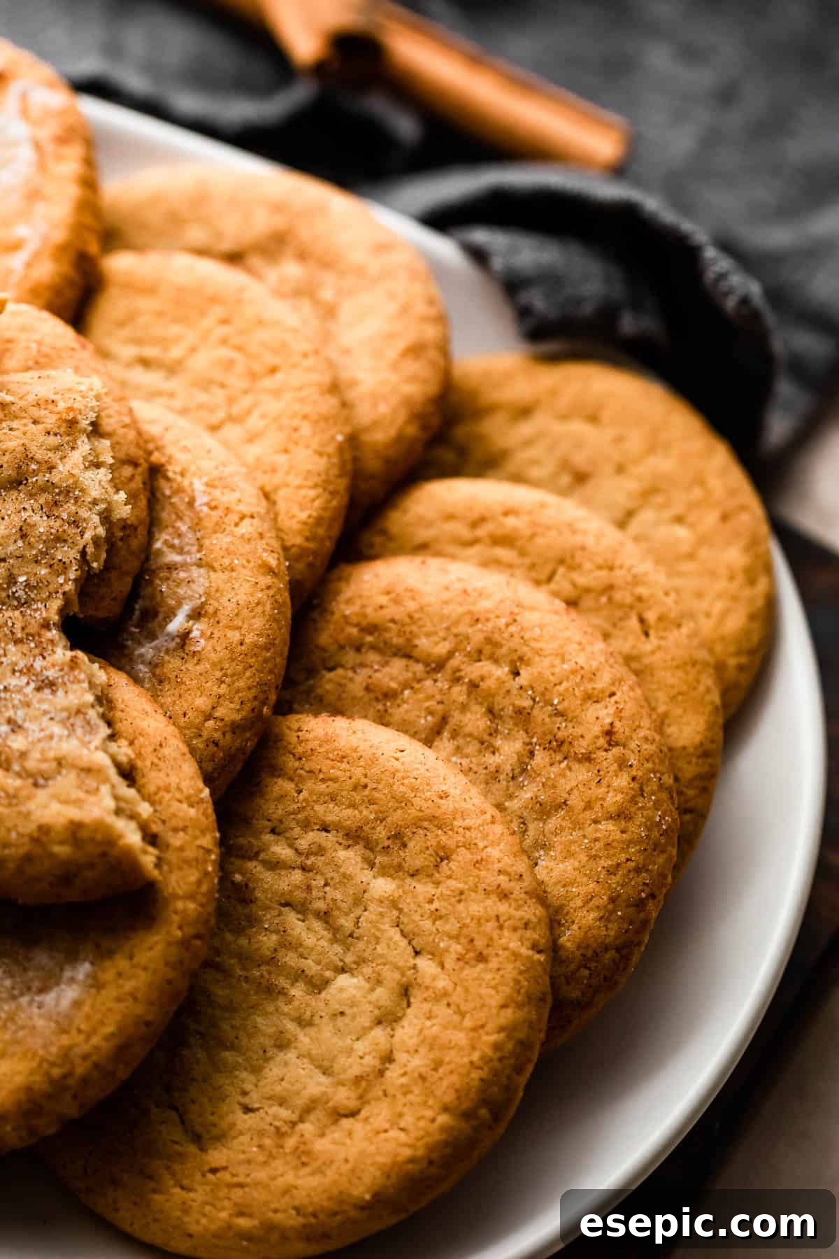 Pillowy Pumpkin Spice Cookies 3 Pumpkin Cookies arranged on a white plate.