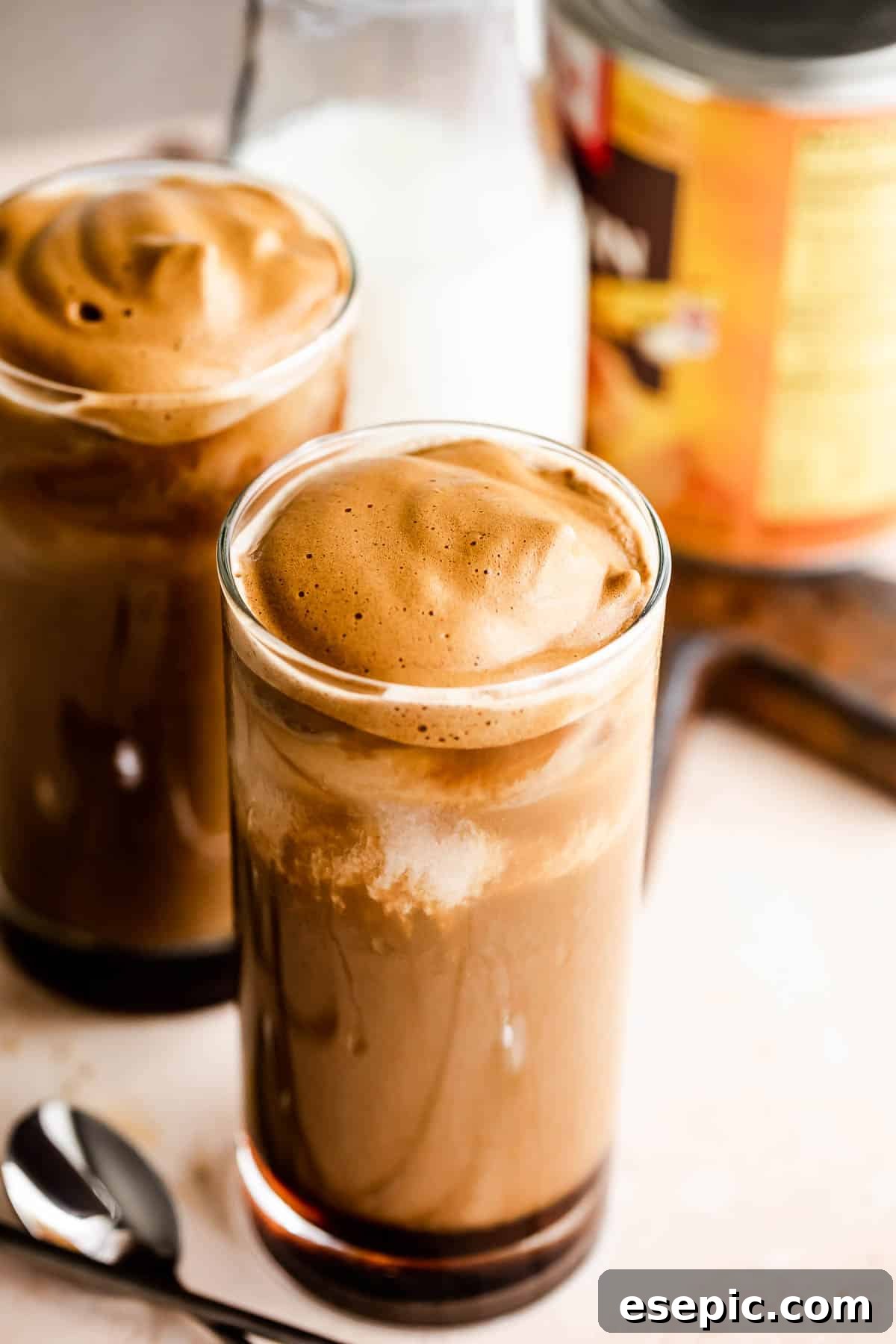 Starbucks Inspired Pumpkin Cream Cold Brew Coffee 3 Pumpkin Cream Cold Brew served in two drinking glasses with a pumpkin can placed right beside them.