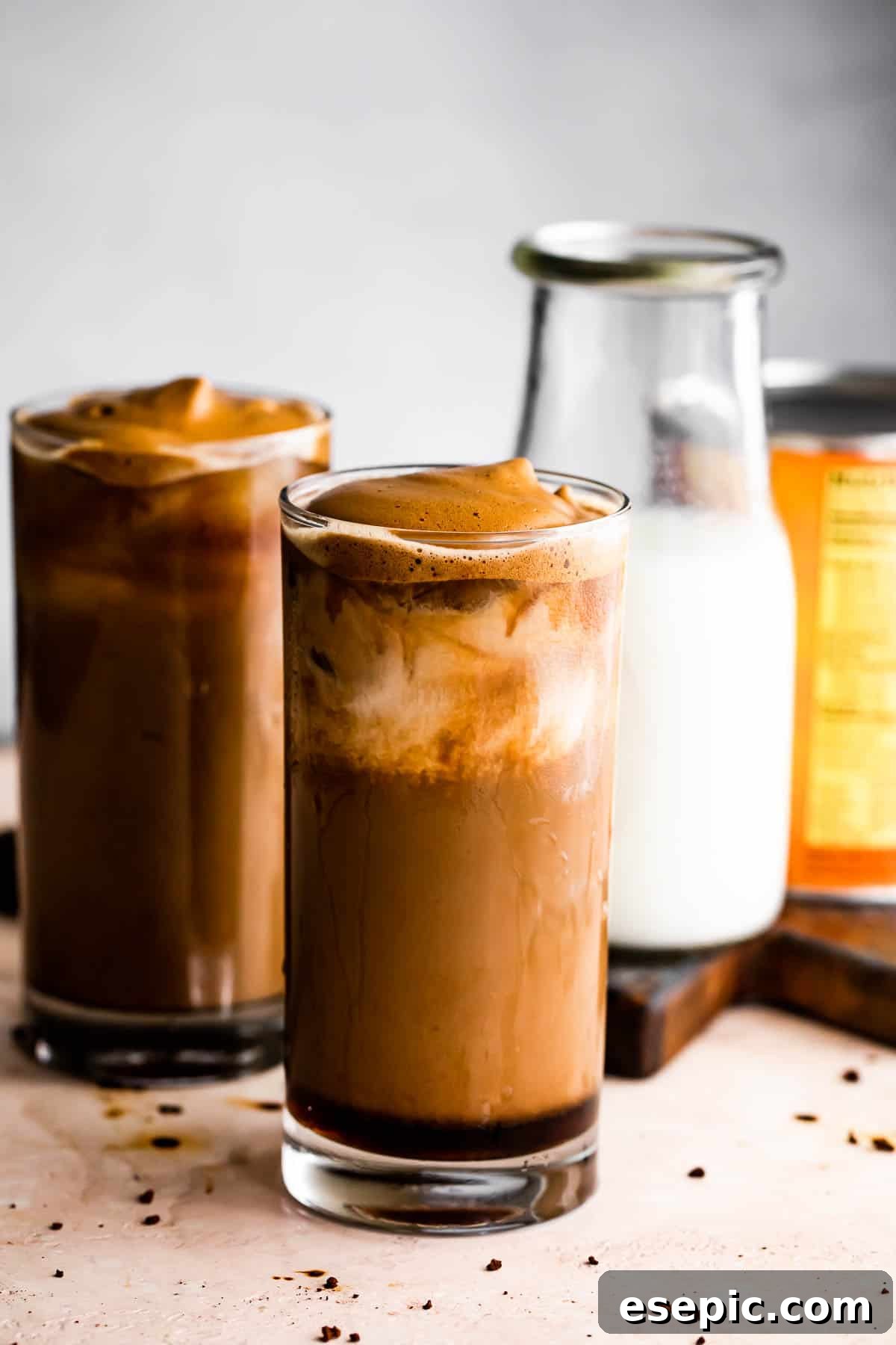 Starbucks Inspired Pumpkin Cream Cold Brew Coffee 6 Pumpkin Cream Cold Brew served in two drinking glasses with a milk bottle placed right beside them.