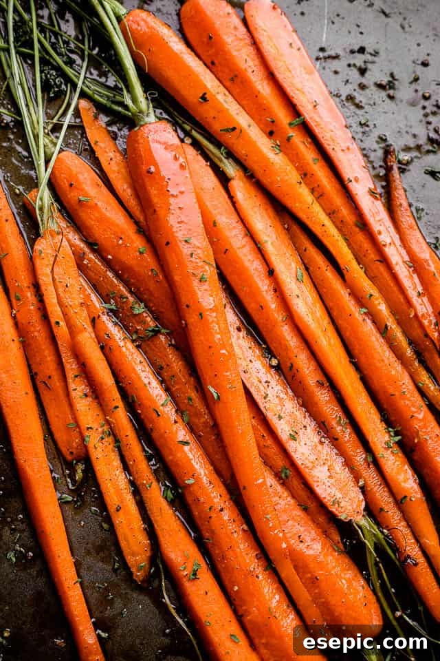Roasted carrots arranged on a baking sheet, ready to be served