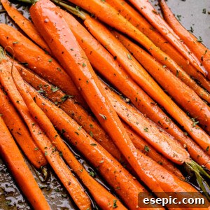 Pan of sweet Honey Balsamic Oven Roasted Carrots, ready to be served as a delicious side dish.