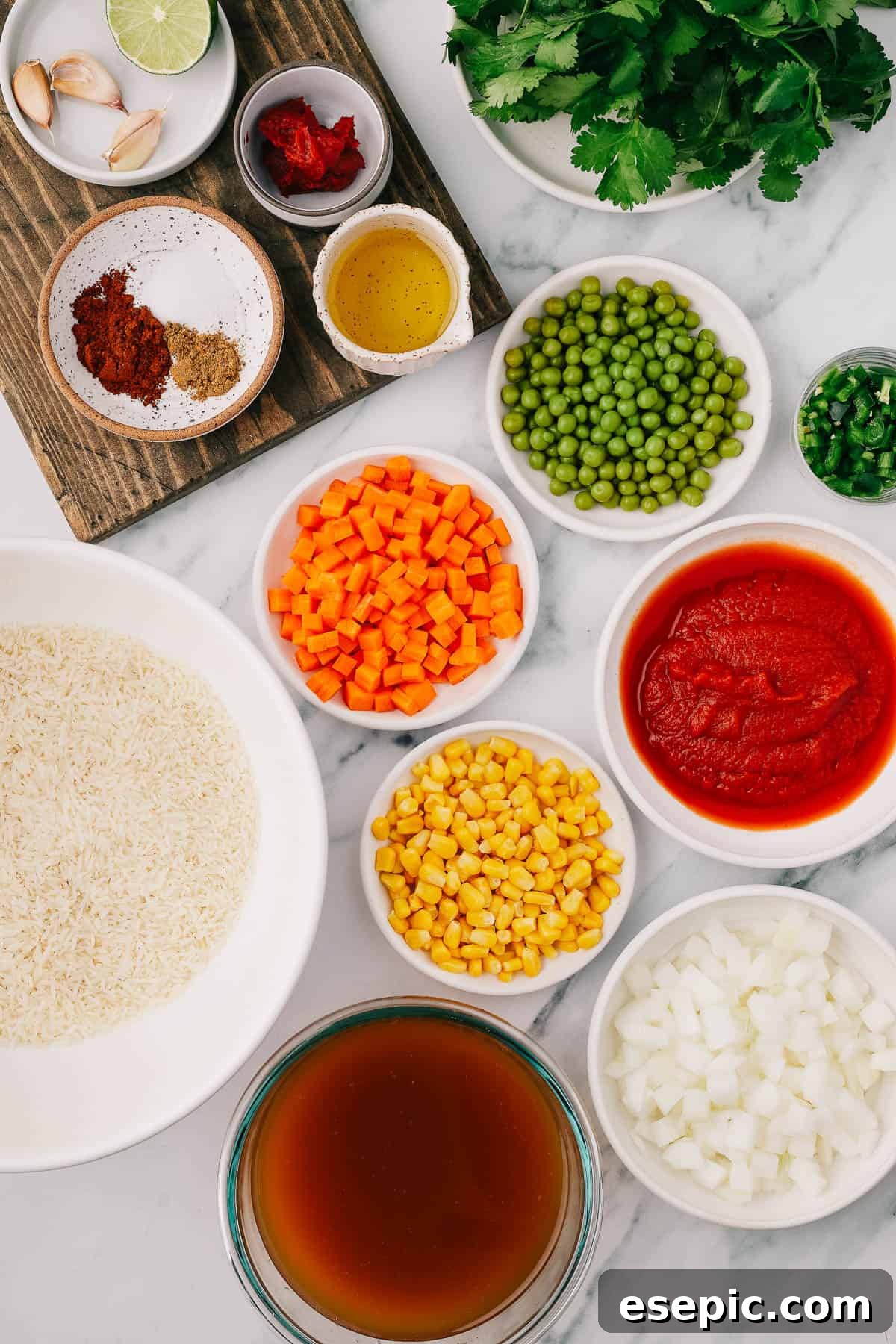 Speedy Instant Pot Mexican Rice 4 From left: garlic, lime, tomato paste, cilantro, chili powder, salt, cumin, oil, peas, jalapeno, rice, carrots, corn, tomato puree, vegetable broth, onion