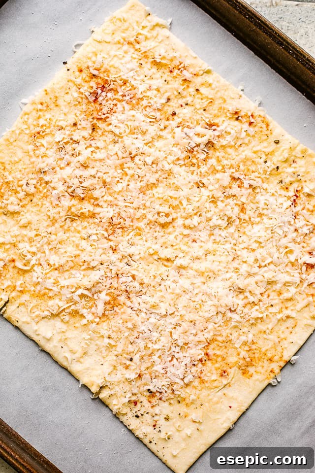 Puff pastry sheet brushed with olive oil and generously layered with a blend of cheeses and spices.
