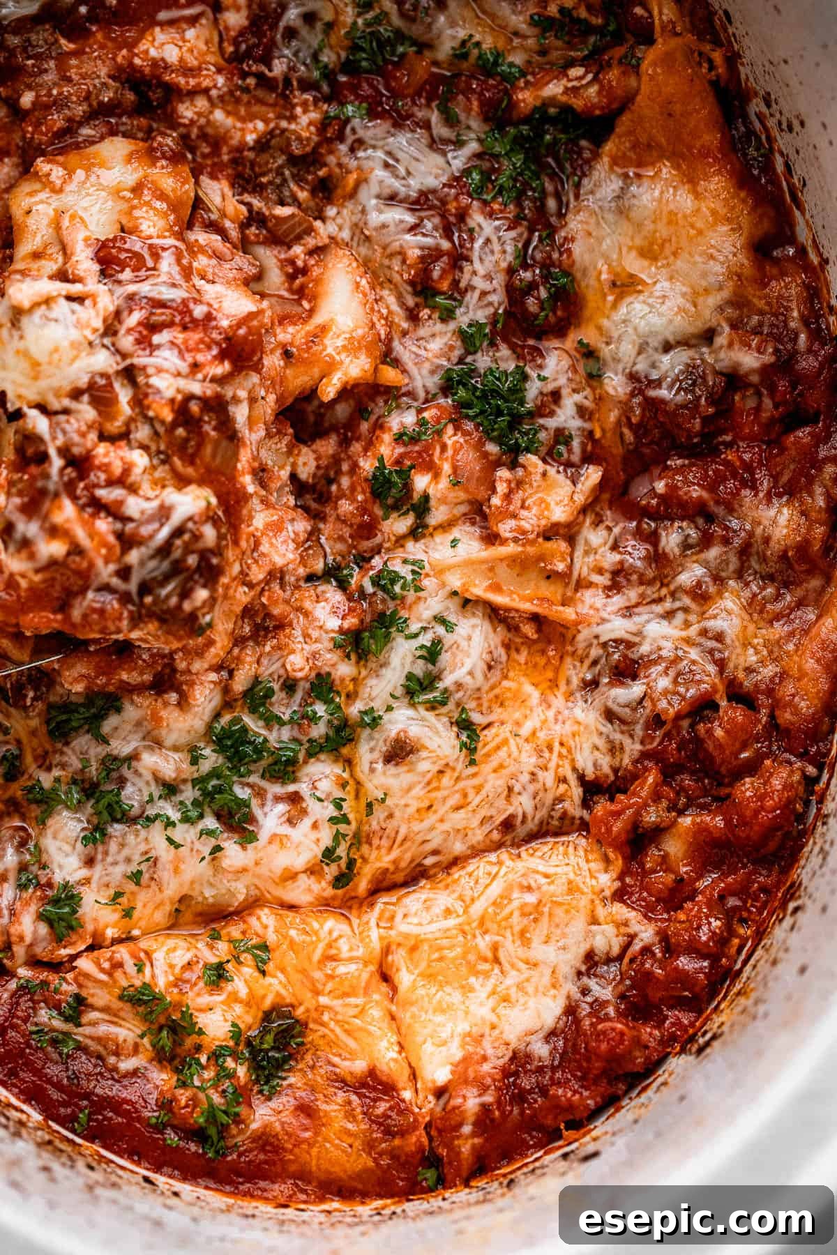 overhead shot of a lasagna inside a slow cooker pot.