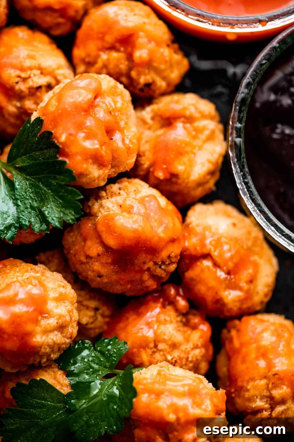Close-up shot of golden, crispy popcorn chicken, showcasing its perfectly textured breading and inviting appeal.