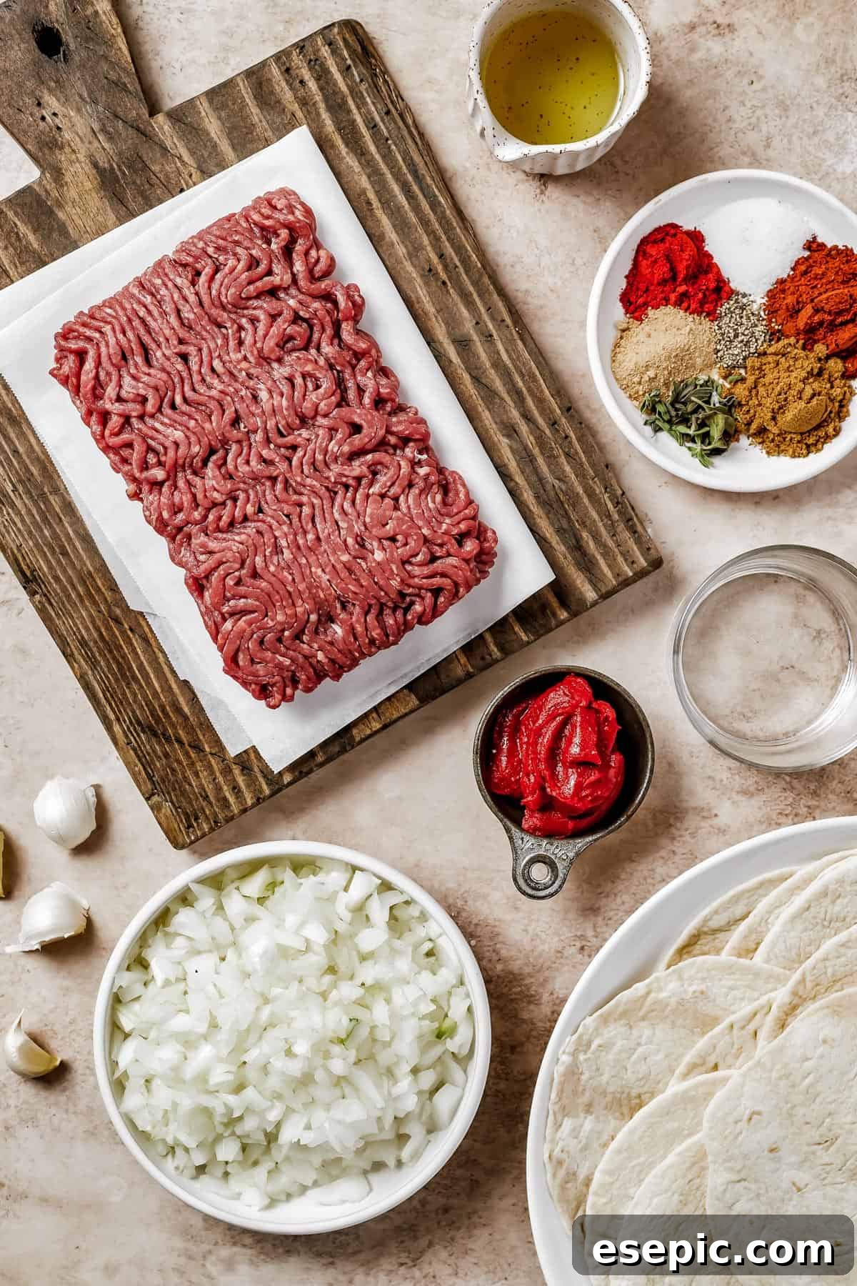 Quick and Flavorful Ground Beef Tacos 4 From top left: Ground beef, oil, spices, water, tomato paste, chopped onions, tortillas.