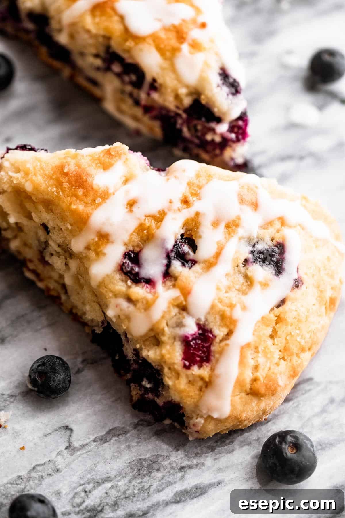 These Blueberry Scones are deliciously moist and easy to make with real, wholesome ingredients. blueberry scones drizzled with icing