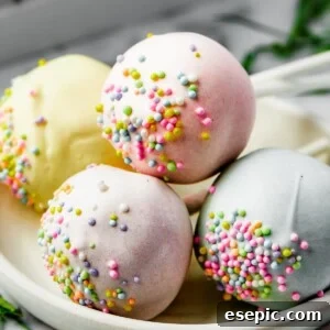 Pastel cake pop lollipops on a white plate.