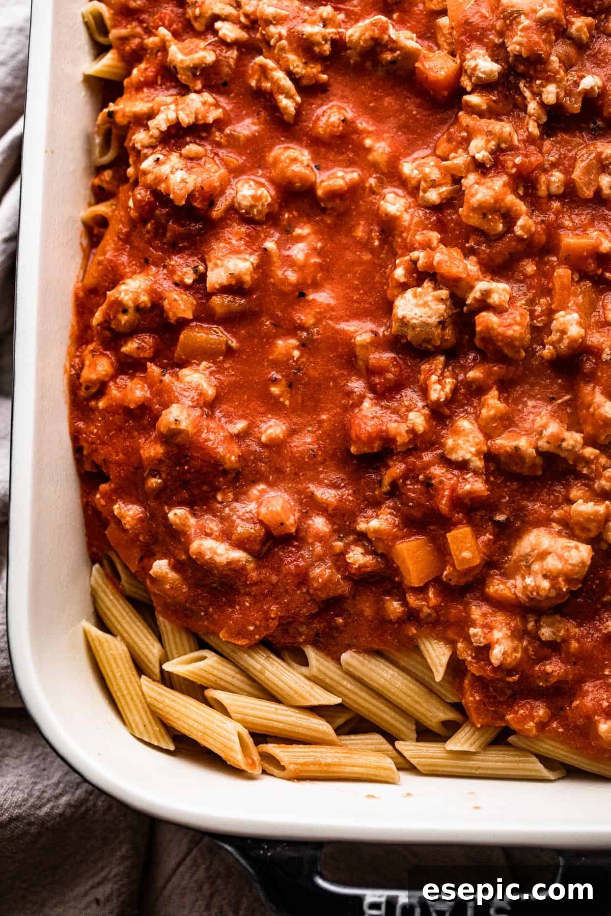 ground turkey tomato sauce poured over penne pasta.