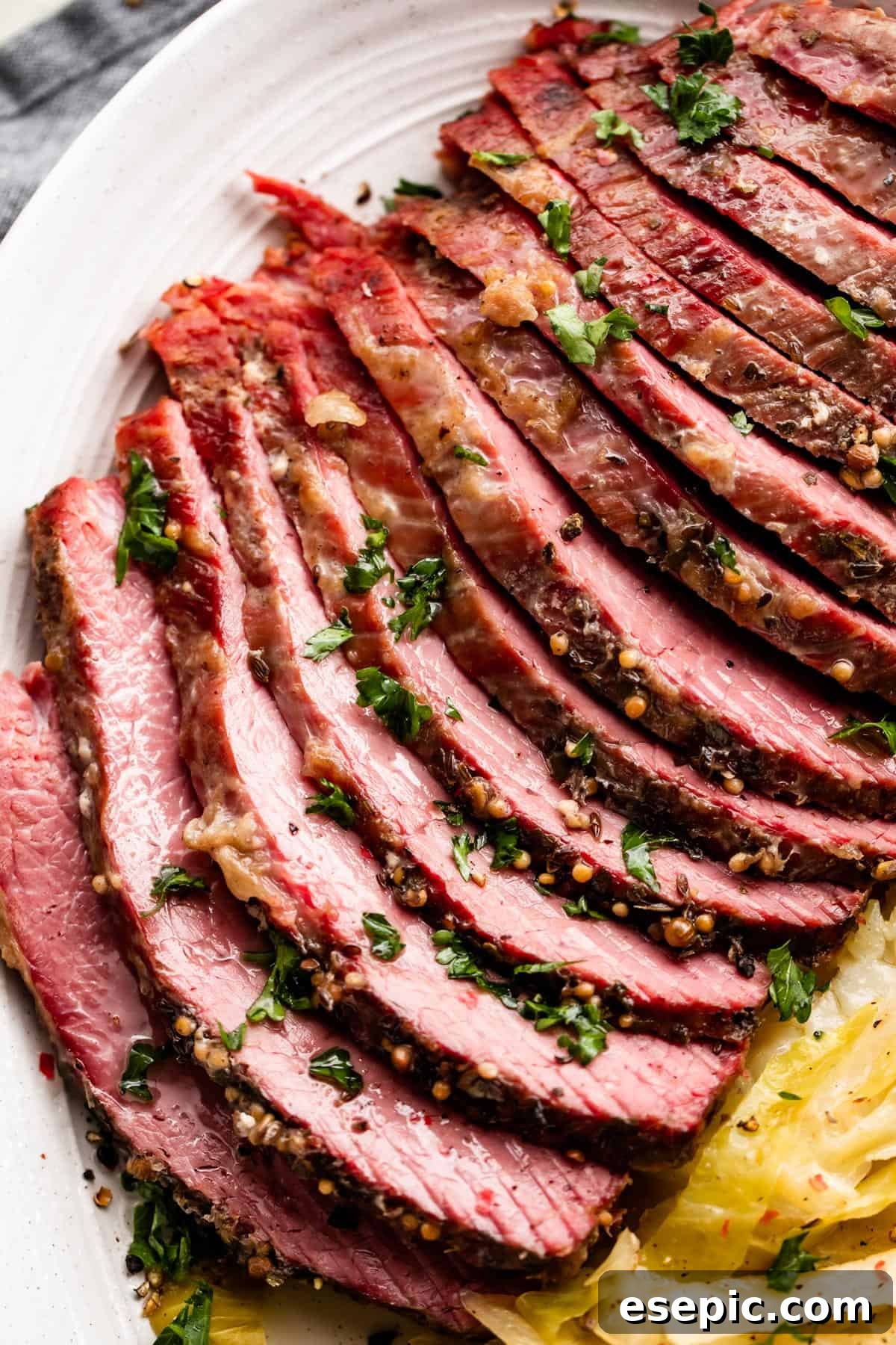A close-up shot of perfectly sliced corned beef, showcasing its tender texture and delicious appearance after being cooked in the Instant Pot.