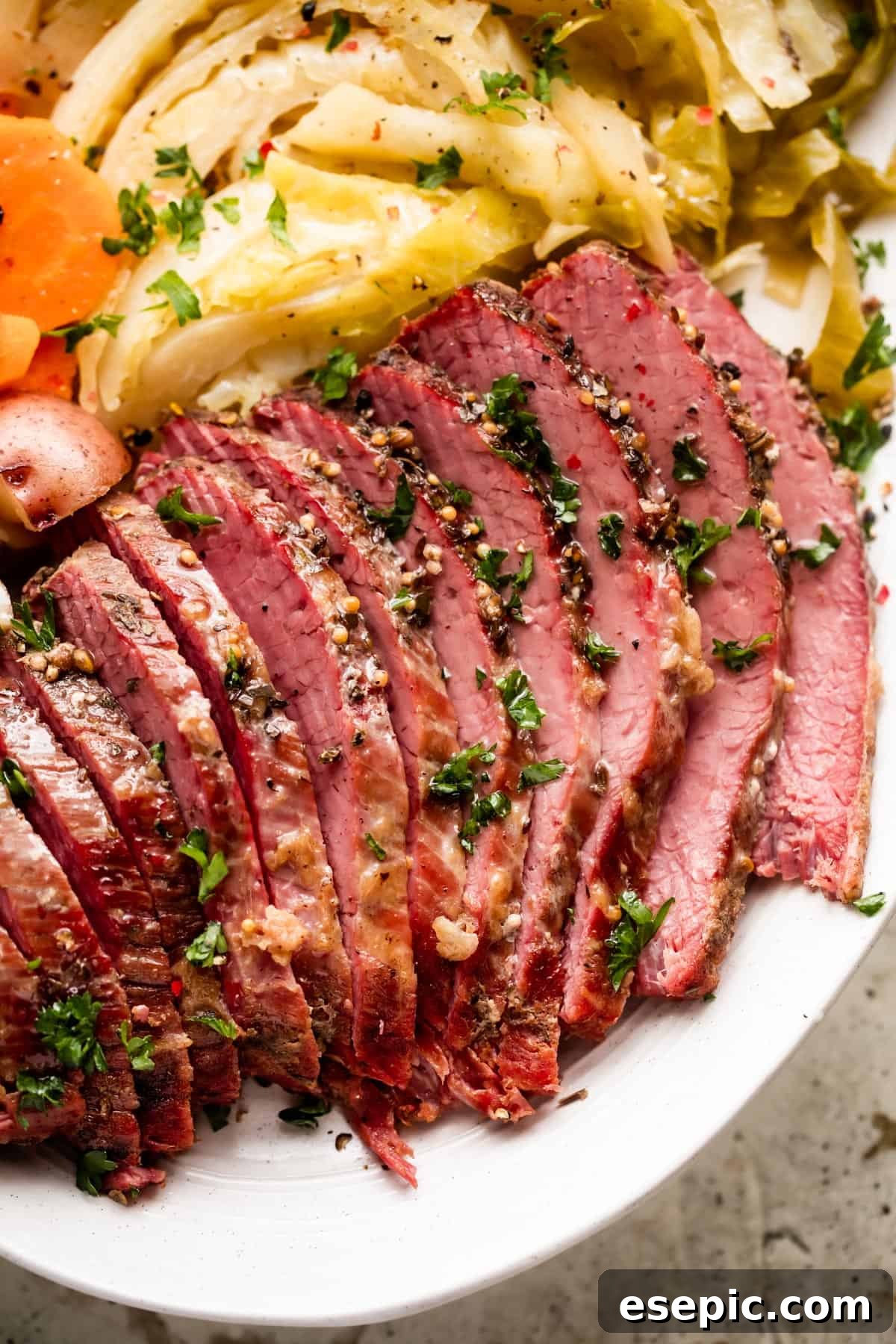 Another enticing view of the sliced Instant Pot corned beef and tender vegetables artfully arranged on a large oval platter.