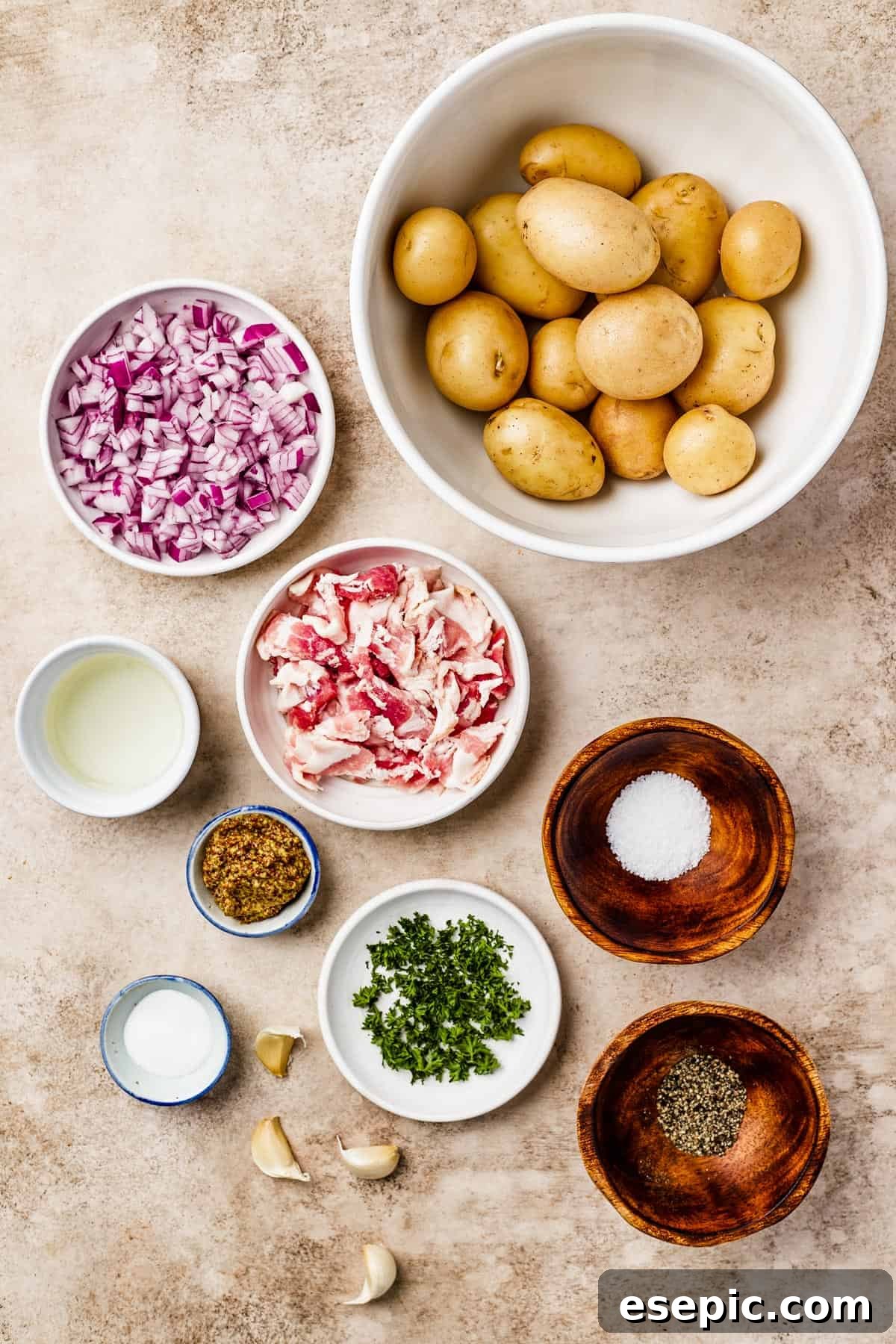 Warm German Potato Salad with Bacon 4 From top: Whole yellow potatoes, finely chopped red onion, white wine vinegar, crispy chopped bacon, whole grain mustard, salt, sugar, minced garlic, fresh parsley, and ground pepper – all essential ingredients for this flavorful salad.