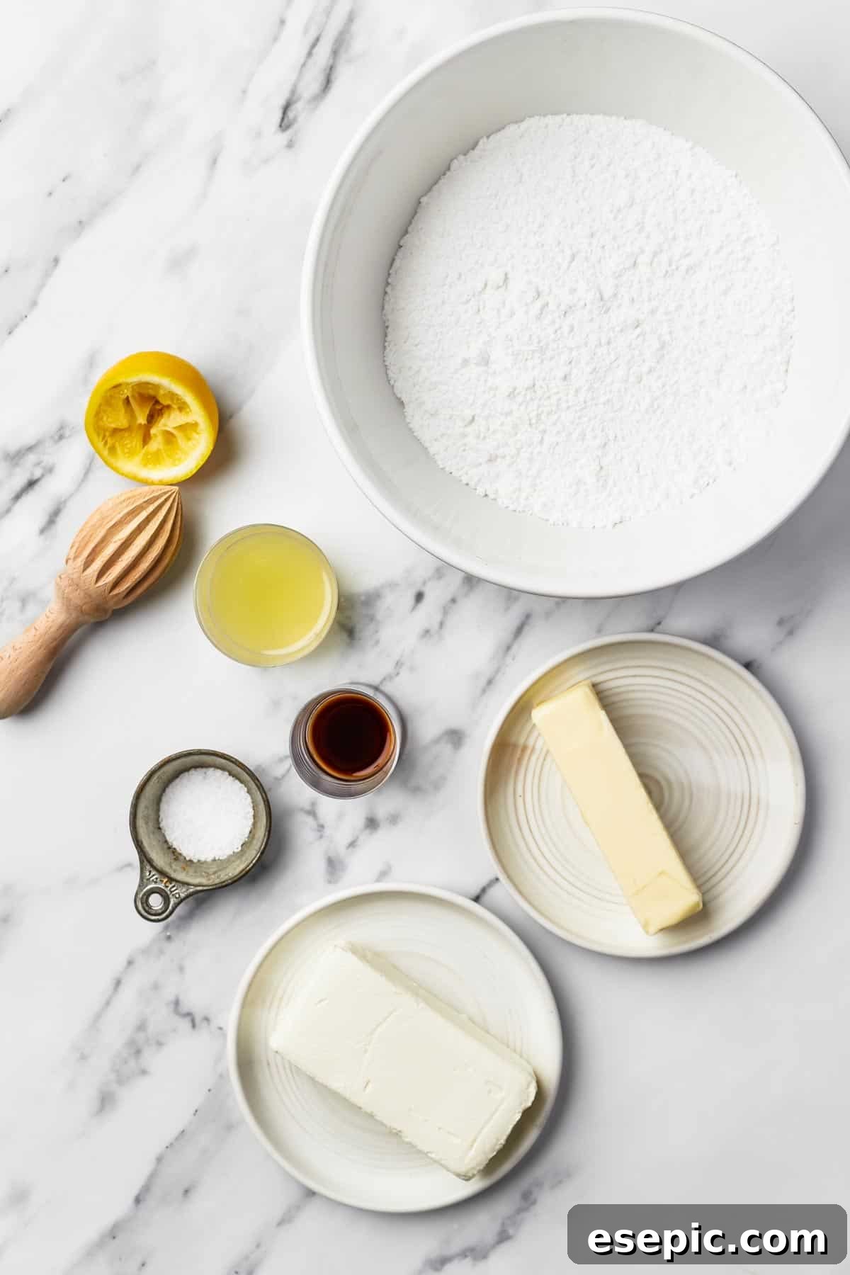 The Ultimate Cream Cheese Frosting 4 From top: Powdered sugar, butter, vanilla, salt, cream cheese, white vinegar – the essential ingredients for cream cheese frosting.