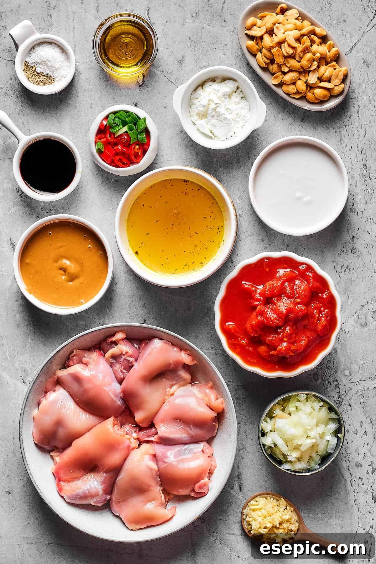Simple Peanut Butter Chicken - Easy, Healthy, and Flavorful! From top left: Salt, olive oil, roasted peanuts, soy sauce, sliced chilies and green onions, cornstarch, peanut butter, chicken stock, coconut milk, chicken thighs, crushed tomatoes, chopped onion, garlic.