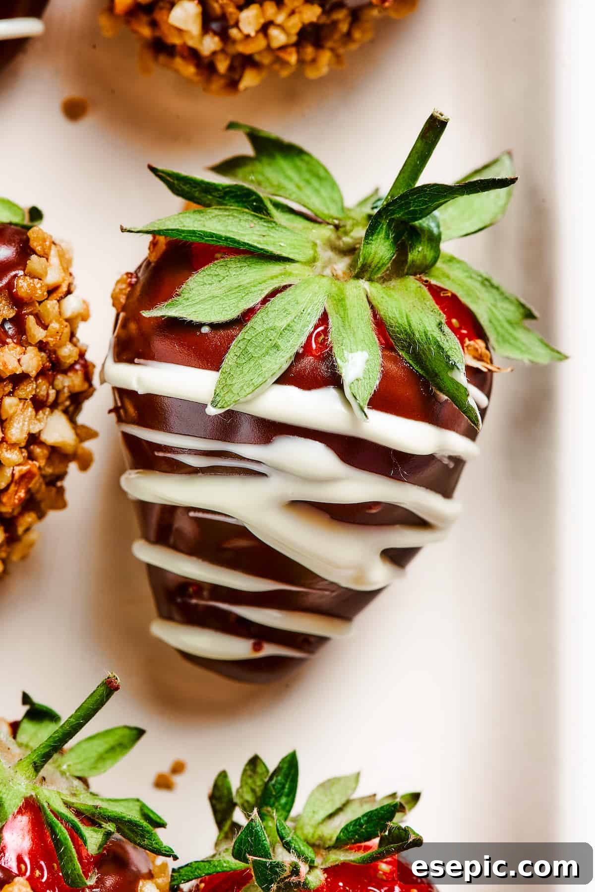 Effortless Chocolate Strawberry Delight 6 A perfectly dipped strawberry, elegantly drizzled with contrasting white chocolate, showcasing a classic decoration technique.