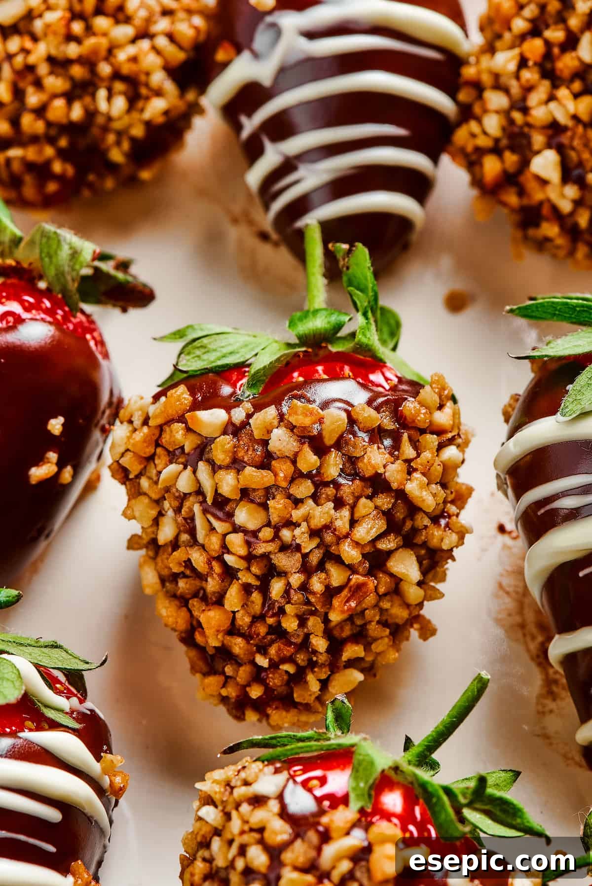 Effortless Chocolate Strawberry Delight 7 A delicious chocolate-dipped strawberry generously coated in crunchy chopped nuts, illustrating a popular topping variation.