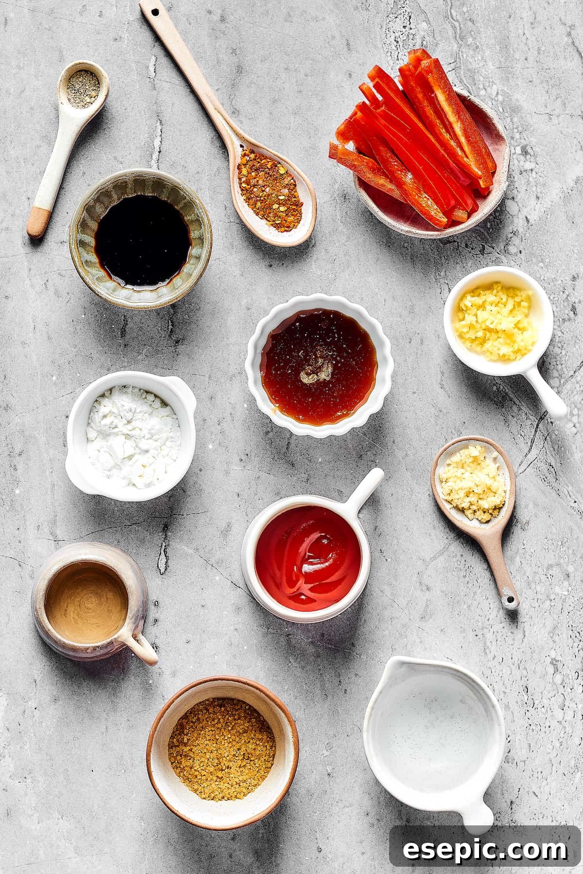 From top: Salt and pepper, spices, red bell pepper slices, cornstarch, tamari, ginger, brown sugar, ketchup, garlic, molasses, rice vinegar.