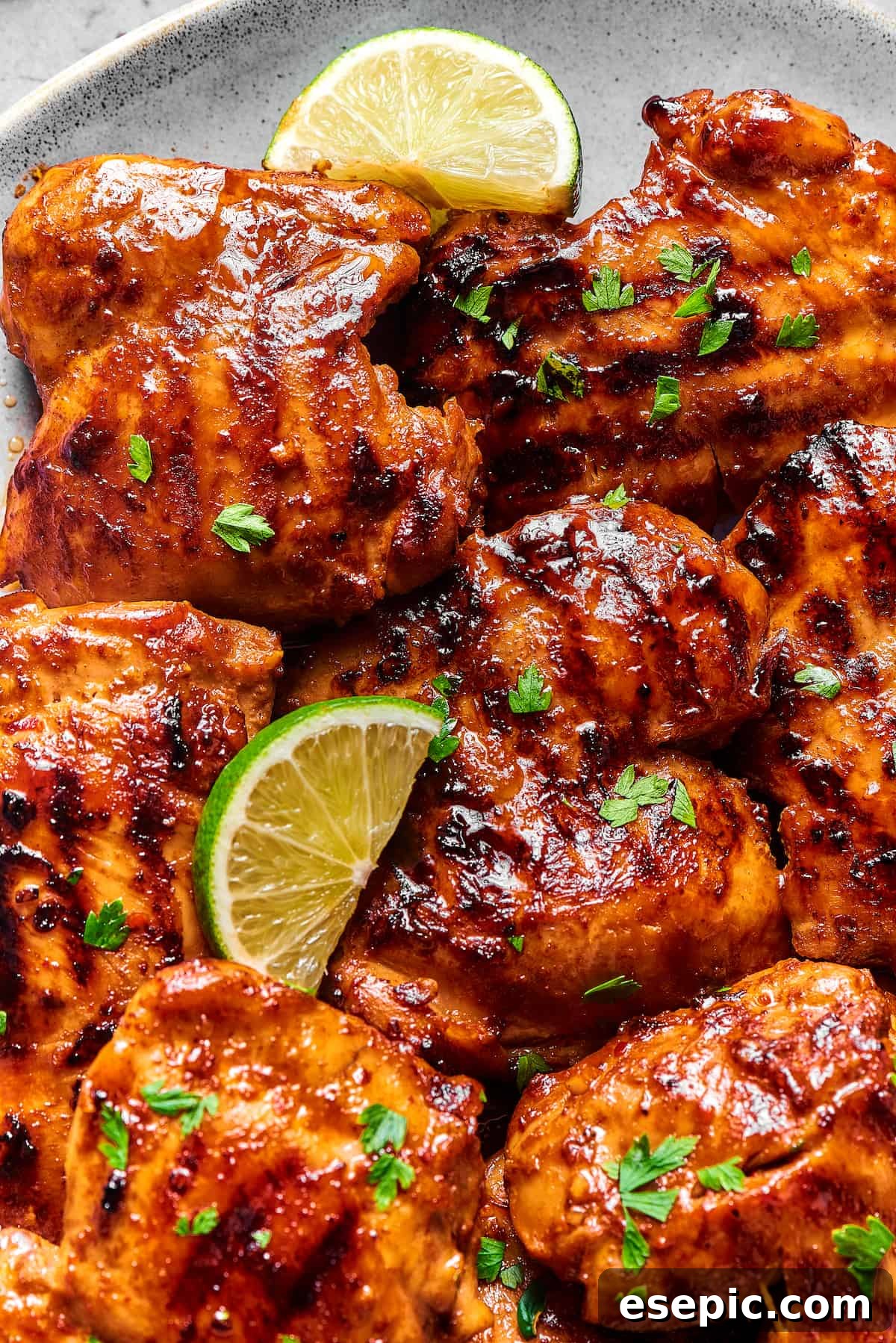 Grilled chicken thighs coated in a sticky sauce.