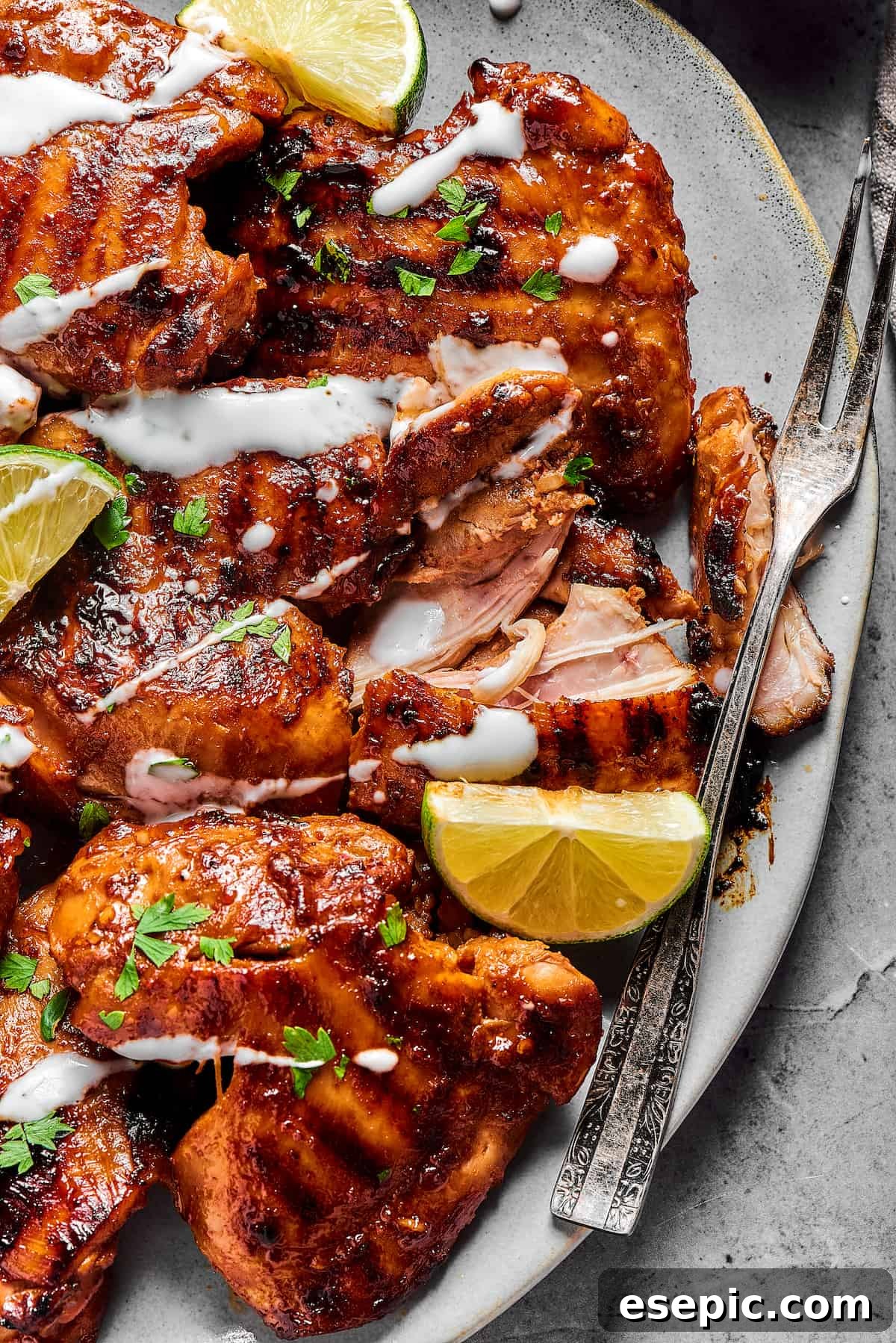 Yogurt-drizzled, marinated grilled chicken thighs.