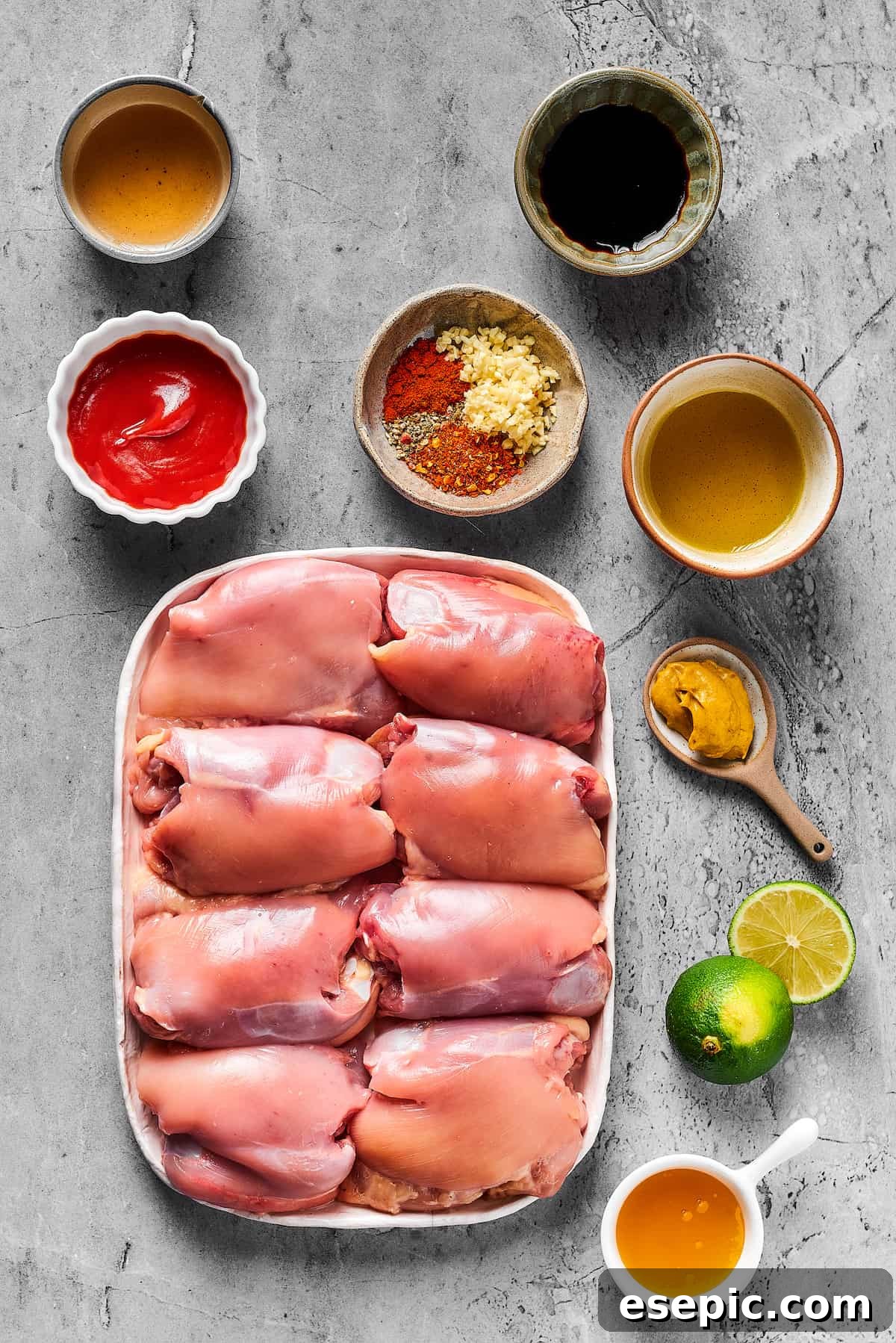 From top left: Olive oil, soy sauce, ketchup, seasonings, honey, dijon mustard, lime, rice vinegar, chicken thighs.