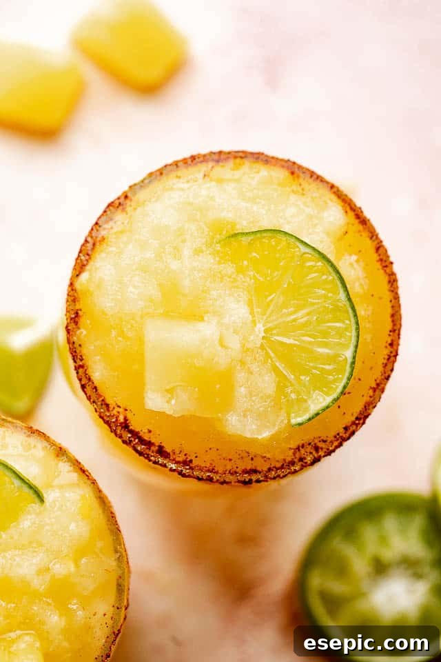 Sun-Kissed Pineapple Margaritas 4 Top view of a beautifully prepared frozen pineapple margarita.