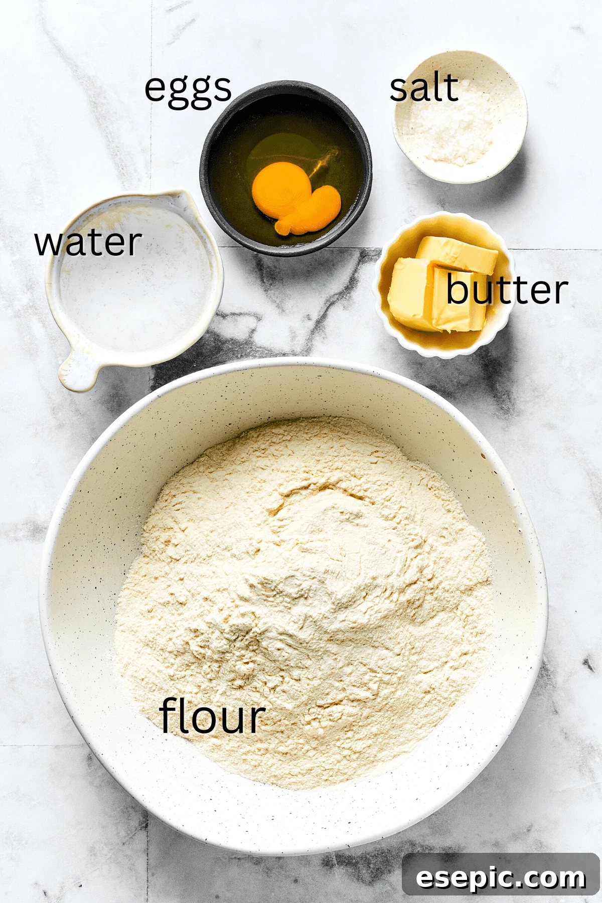 Key Ingredients for Tender Homemade Pierogi Dough Ingredients for pierogi dough including all-purpose flour, salt, unsalted butter, warm water, and a large egg.