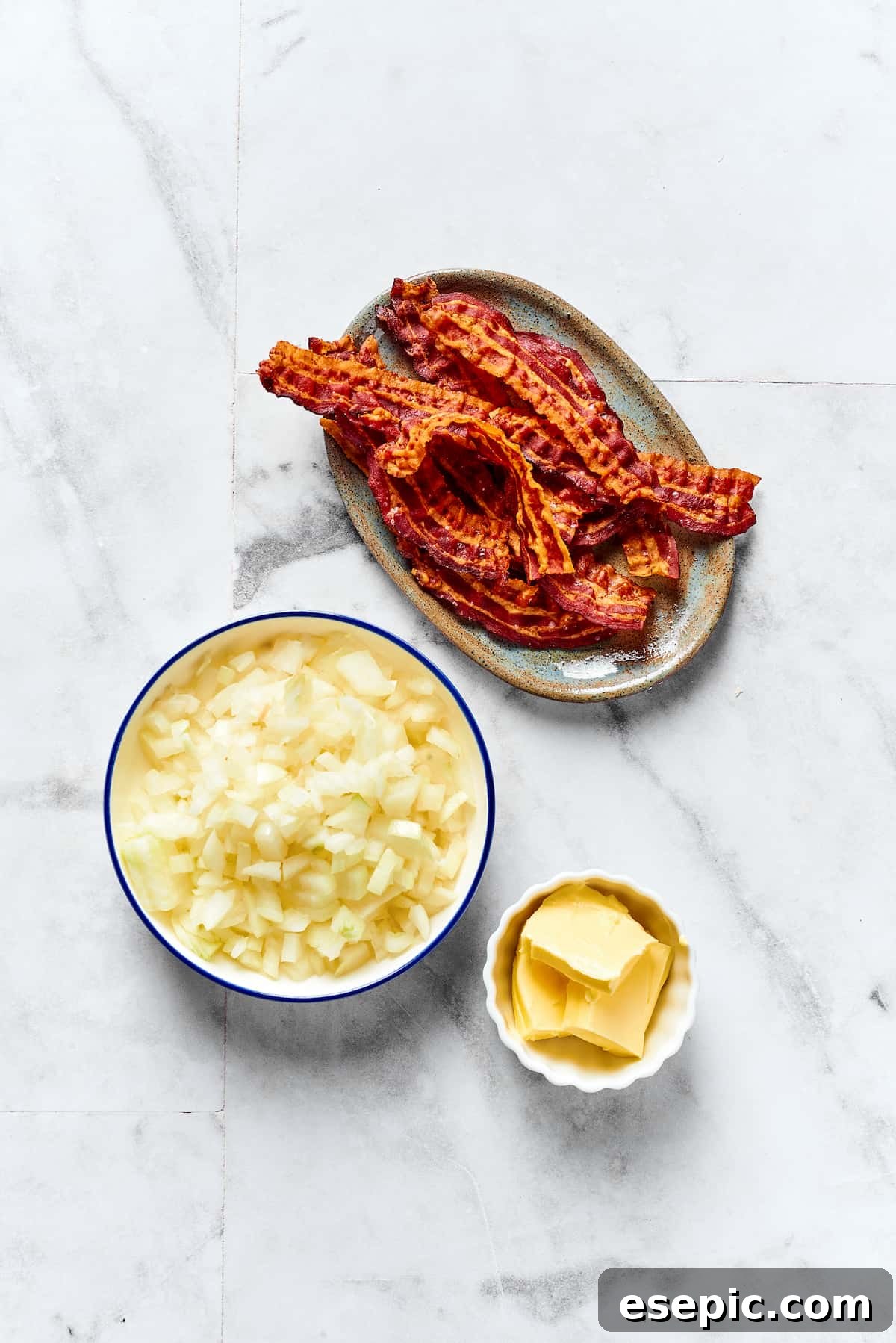 Garnishing Ingredients: Bacon, Onions, and Butter for Pierogi Ingredients for pierogi topping: crispy cooked bacon, chopped yellow onions, and unsalted butter for caramelization.
