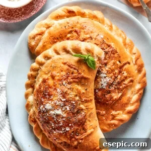 Two pizza pockets on a blue plate.