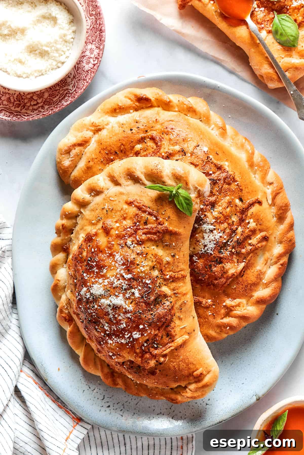 Two pizza pockets on a blue plate.