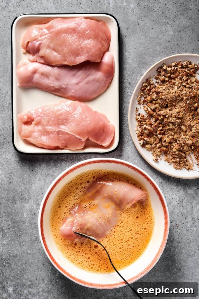 Breading chicken.