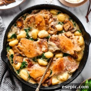 Creamy chicken and gnocchi in a cast-iron skillet.