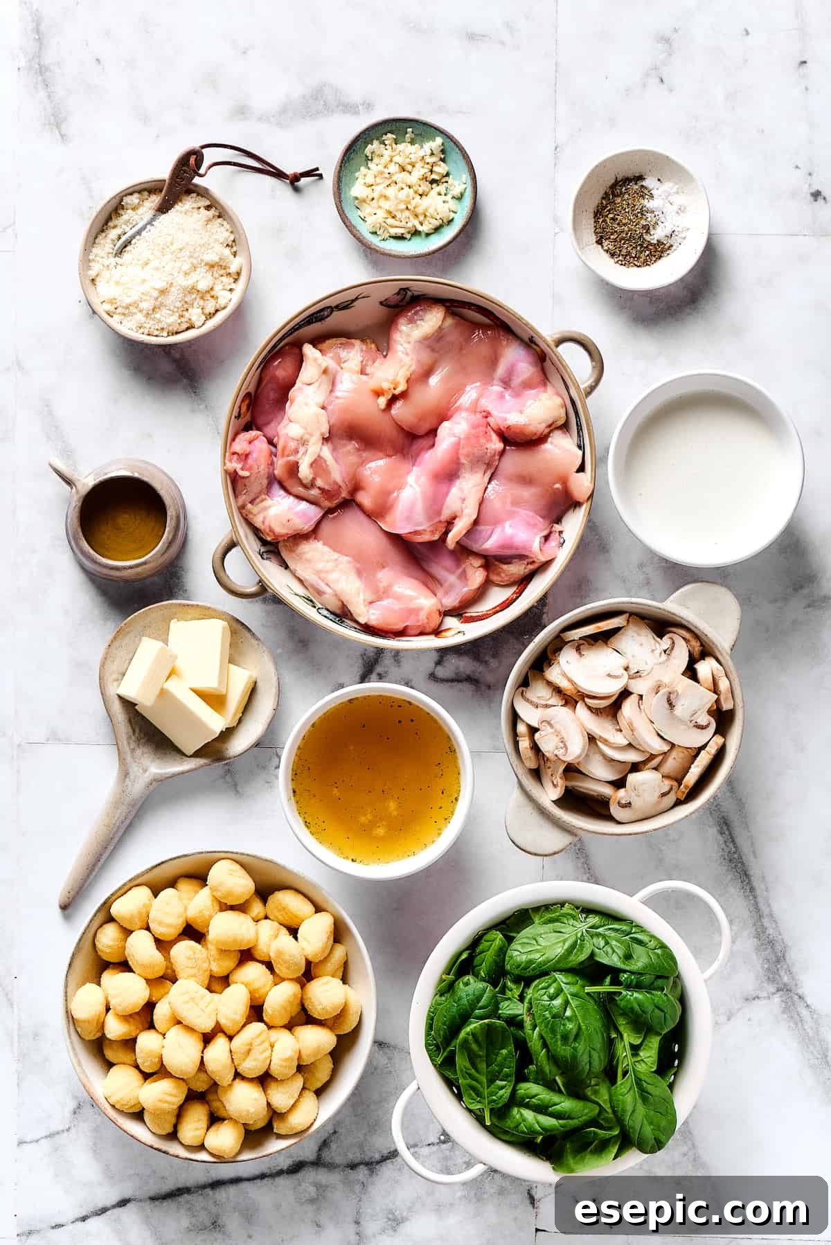 Fresh Ingredients for Creamy Chicken & Gnocchi Chicken gnocchi ingredients measured and arranged on a table, including chicken, spinach, mushrooms, and cream.