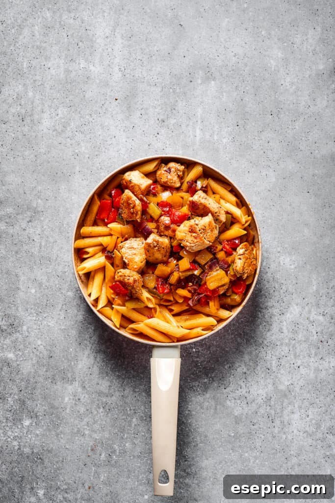 Chicken fajita pasta in a skillet.