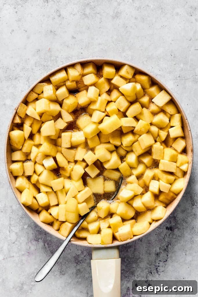 Cooking apples in a skillet.