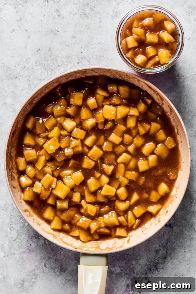 Apple filling in a skillet and a small bowl.