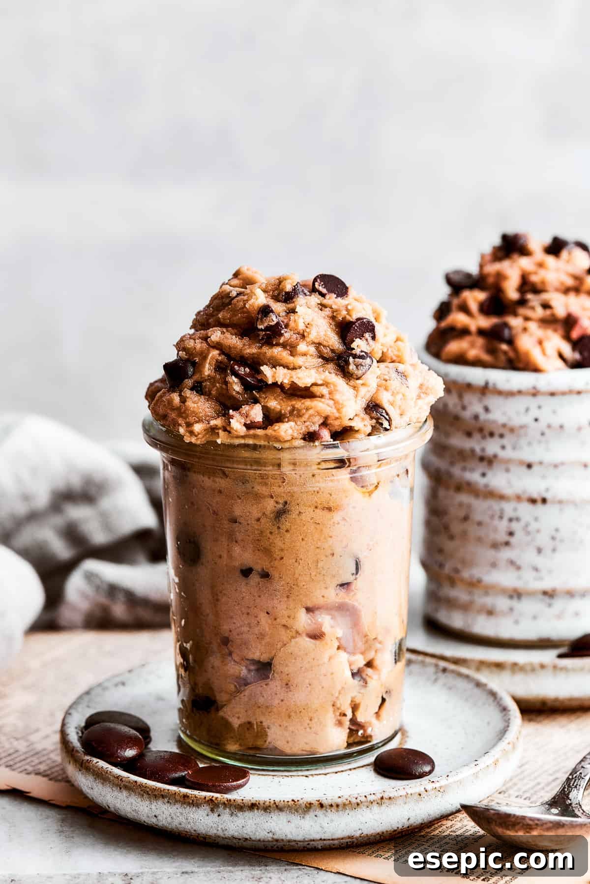 Edible cookie dough neatly placed inside two glass jars, ready for gifting or individual servings.