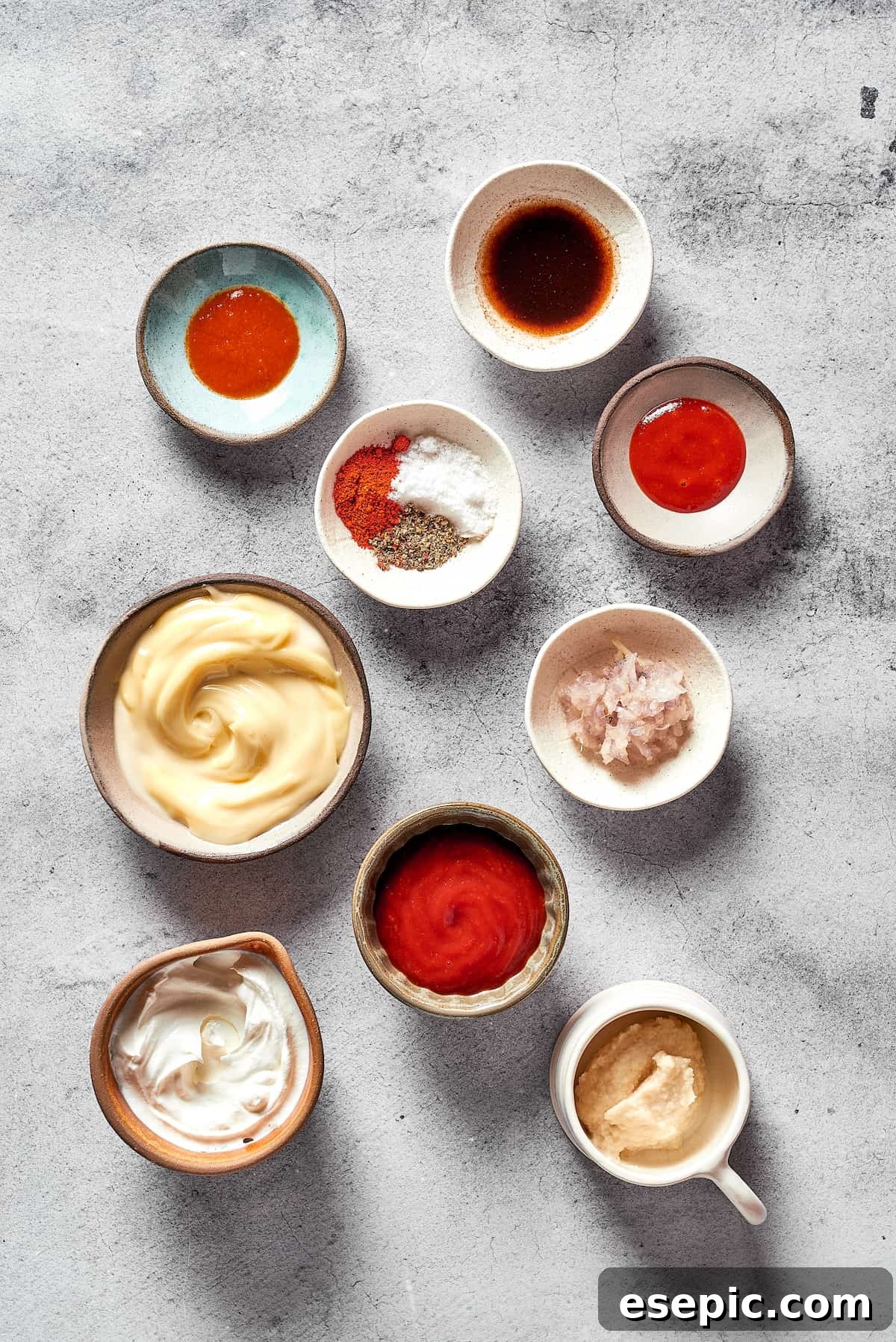 Russian dressing ingredients measured and arranged in small dishes.