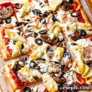 rectangular capricciosa pizza cut into squares