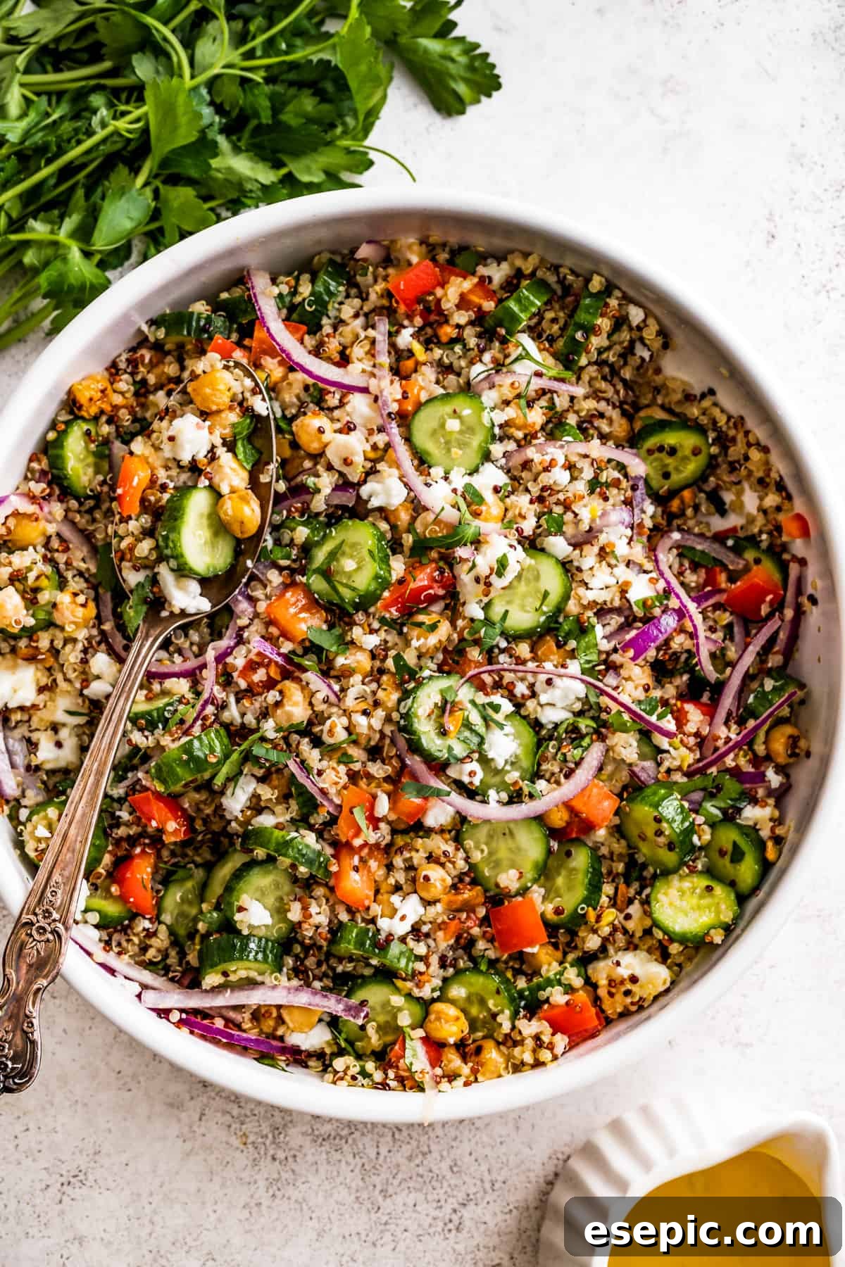 An inviting overhead shot of a generous bowl of Jennifer Aniston's bulgur salad, brimming with fresh ingredients and vibrant colors.