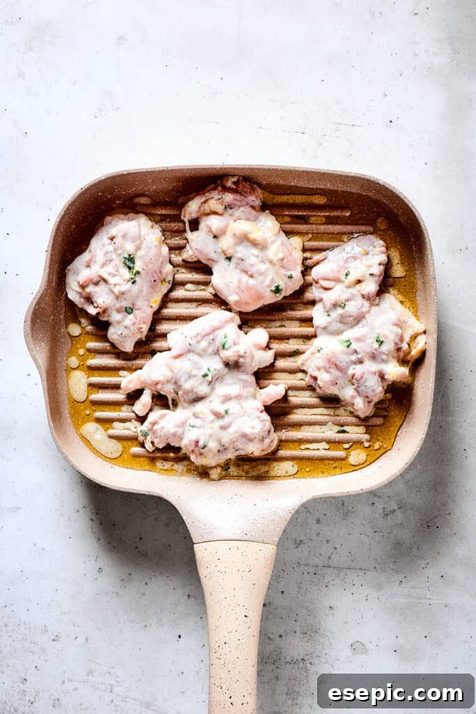 Yogurt Marinated Chicken is an easy grilled chicken recipe that’s versatile, zesty, and easy to make. Everyone will rave over this easy dish! Grilling chicken thighs on a grill pan.