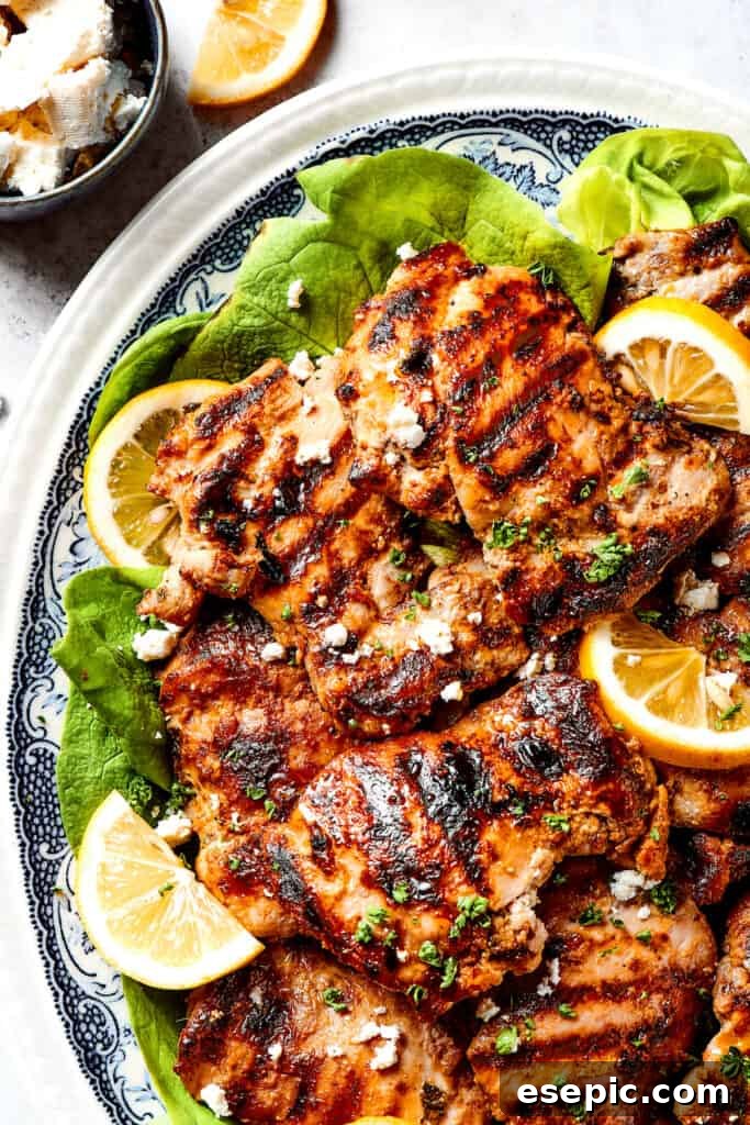 Yogurt Marinated Chicken is an easy grilled chicken recipe that’s versatile, zesty, and easy to make. Everyone will rave over this easy dish! A platter of yogurt marinated chicken with grill marks.