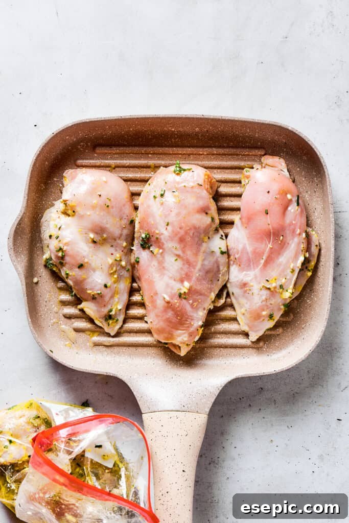 Cooking chicken on a grill pan.