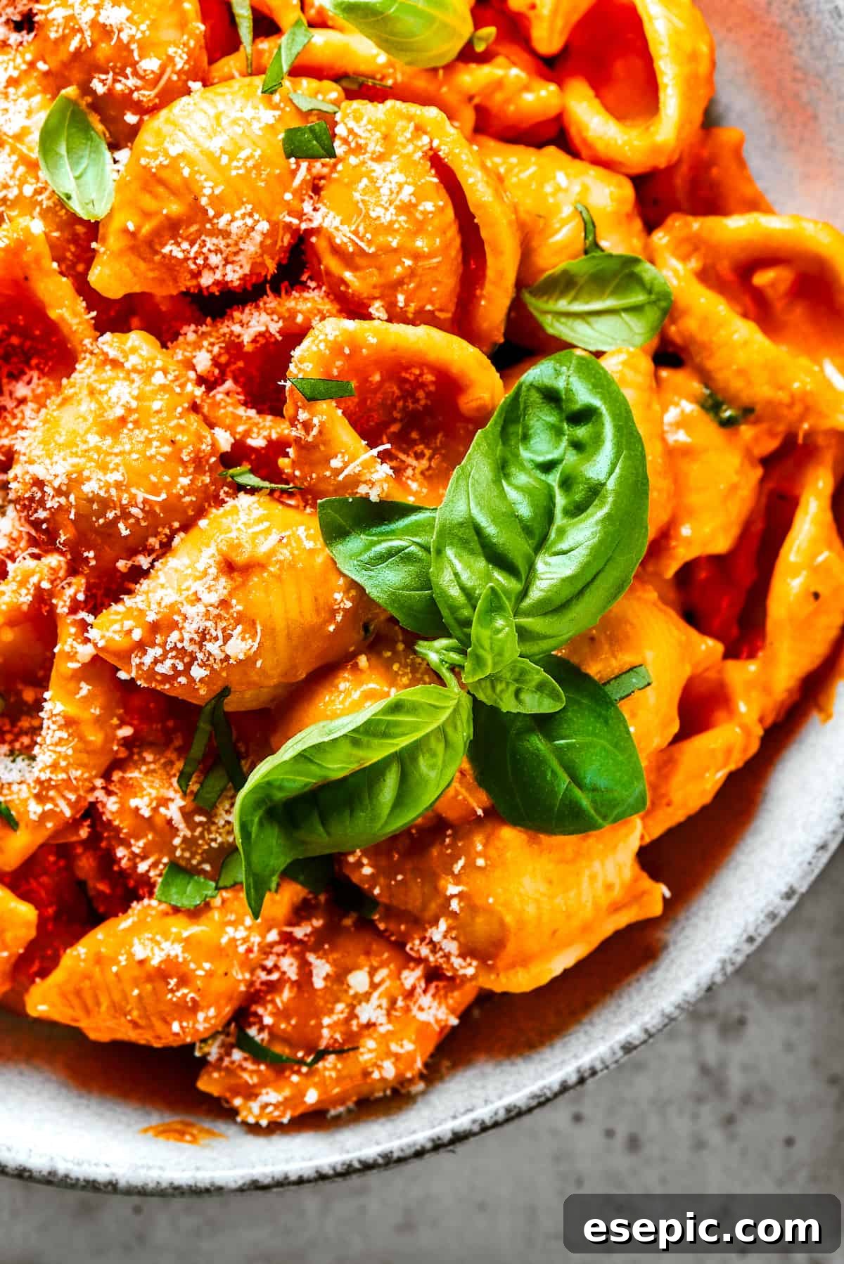 Gigi Hadid Pasta is an easy recipe that every busy cook should know! With tender pasta, red pepper flakes, and cream, it's total comfort food. Pasta shells in creamy tomato sauce, generously sprinkled with parmesan and fresh basil.