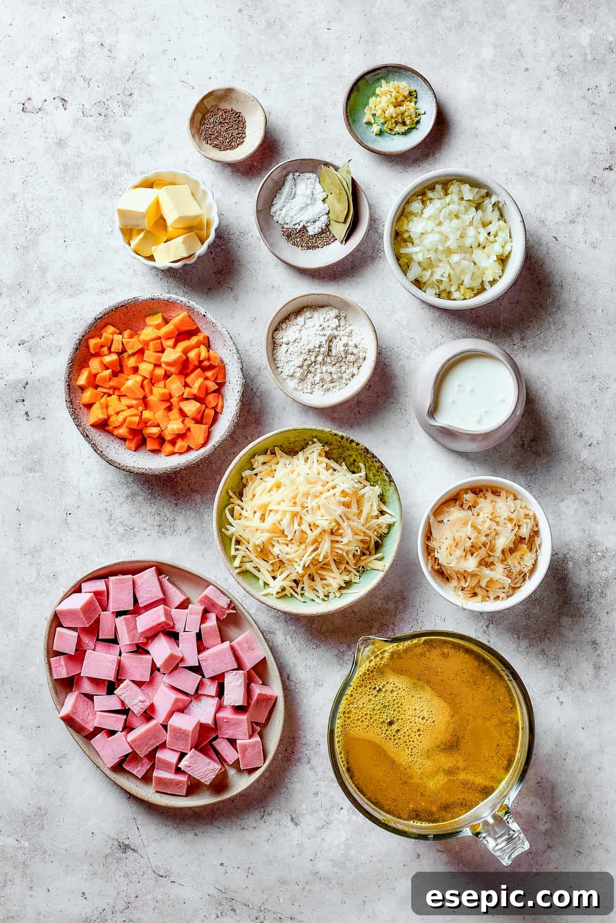 Reuben Comfort Bowl 4 Ingredients for Reuben soup meticulously measured and arranged on a wooden table, ready for cooking.