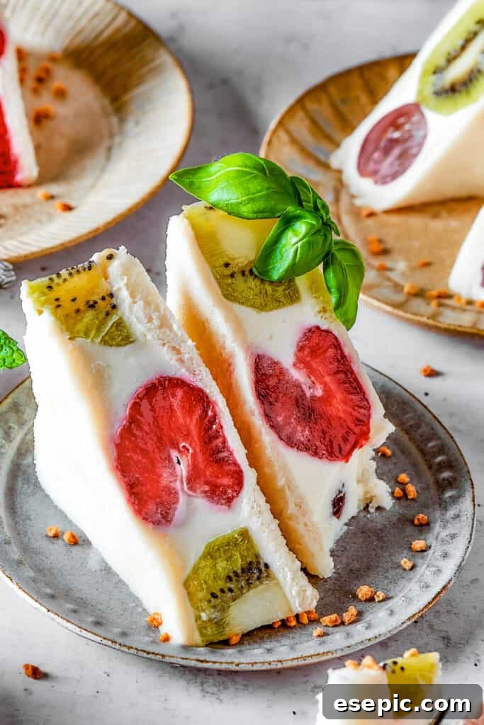 A vibrant kiwi and strawberry fruit sando, perfectly cut and ready to serve.
