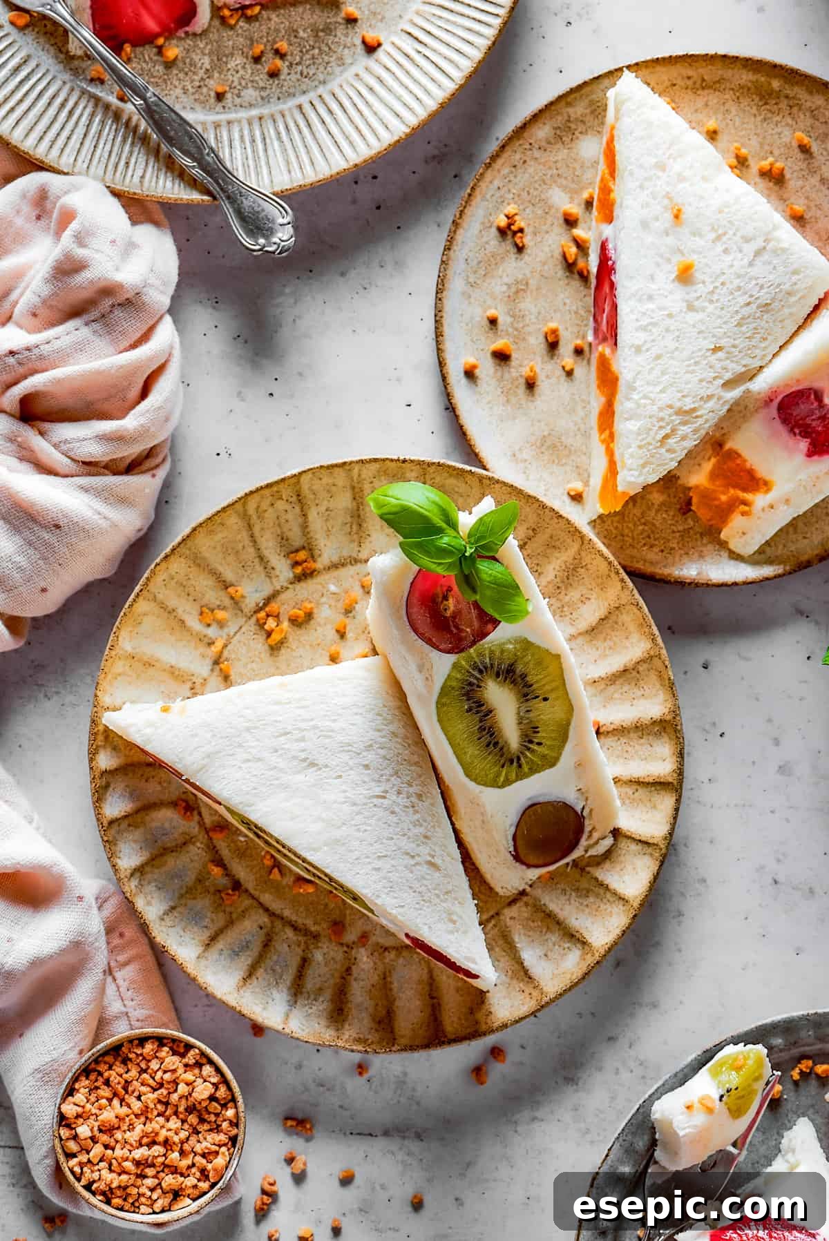Japanese Fruit Sandwiches beautifully arranged on small, decorative plates, ready to be served.