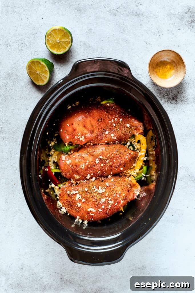 Fajita chicken in a crockpot with peppers.