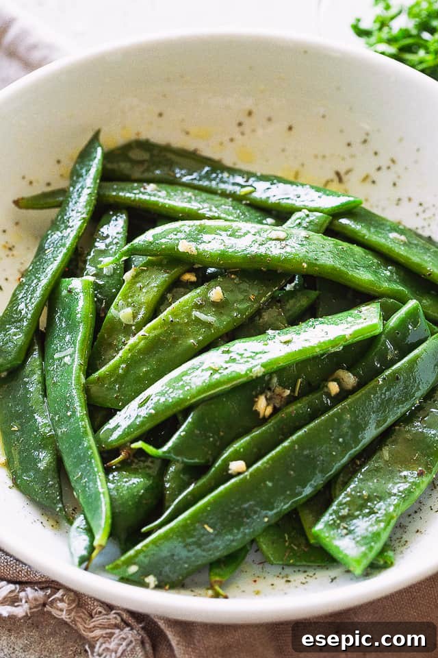 Blanched Italian Flat Beans served in a large white bowl, ready for seasoning.