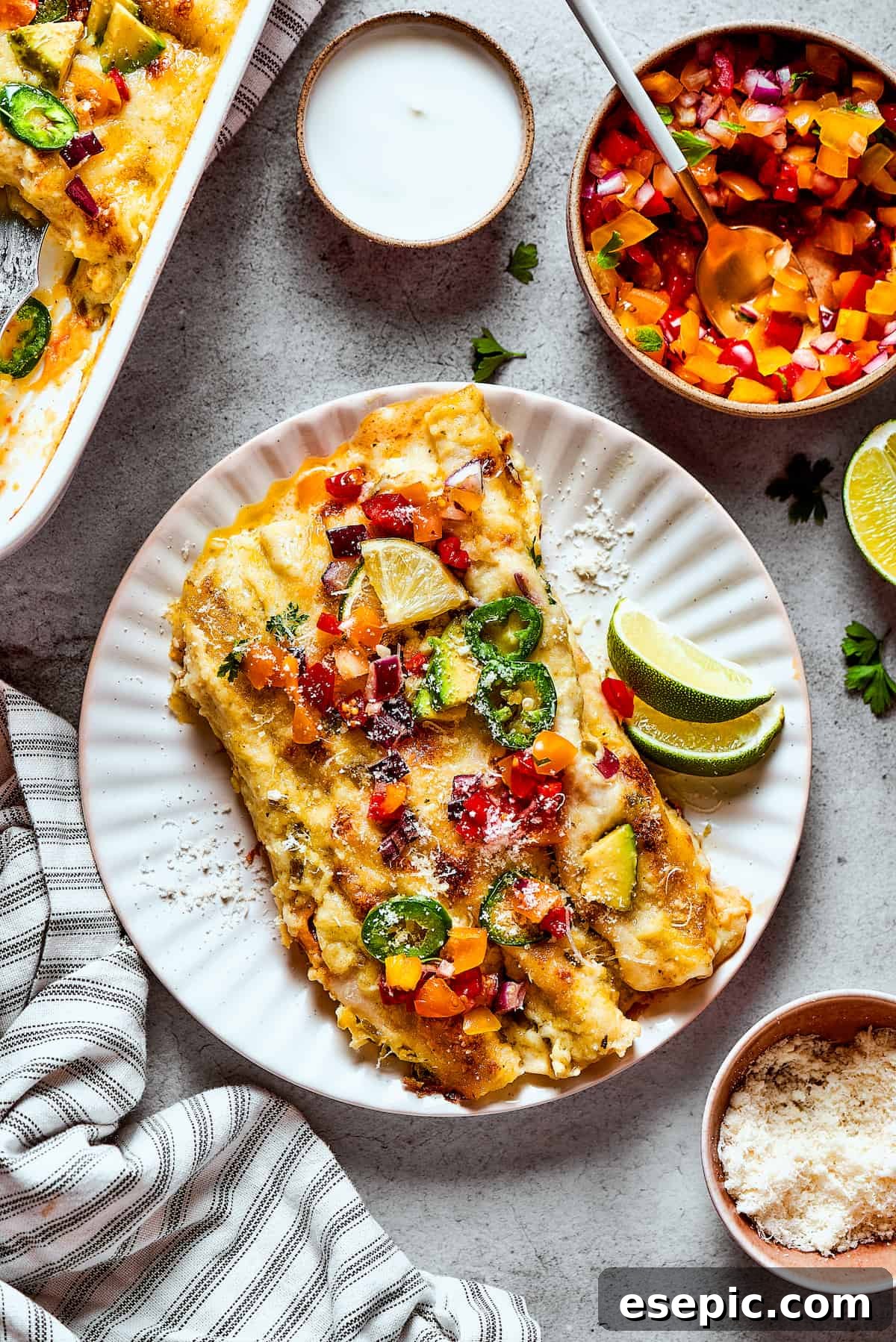 Two shrimp enchiladas on a plate.