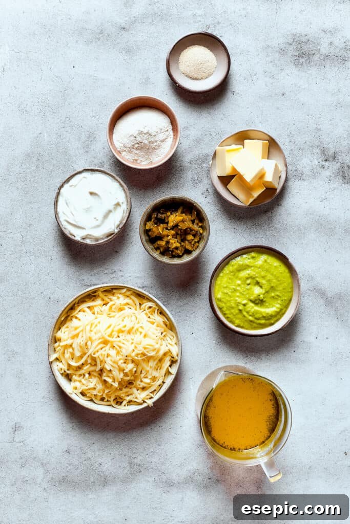 Ingredients for enchilada cheese sauce, measured and arranged on a table.